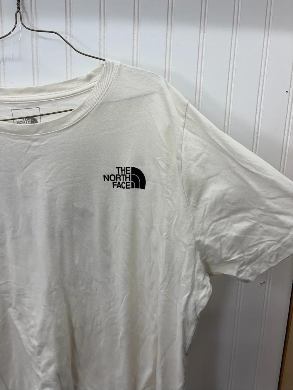 The North Face Men’s Cream Short-Sleeve Logo Tee with Black Chest Emblem